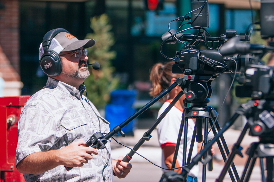 Volunteer filming the Cherry Royale Parade.