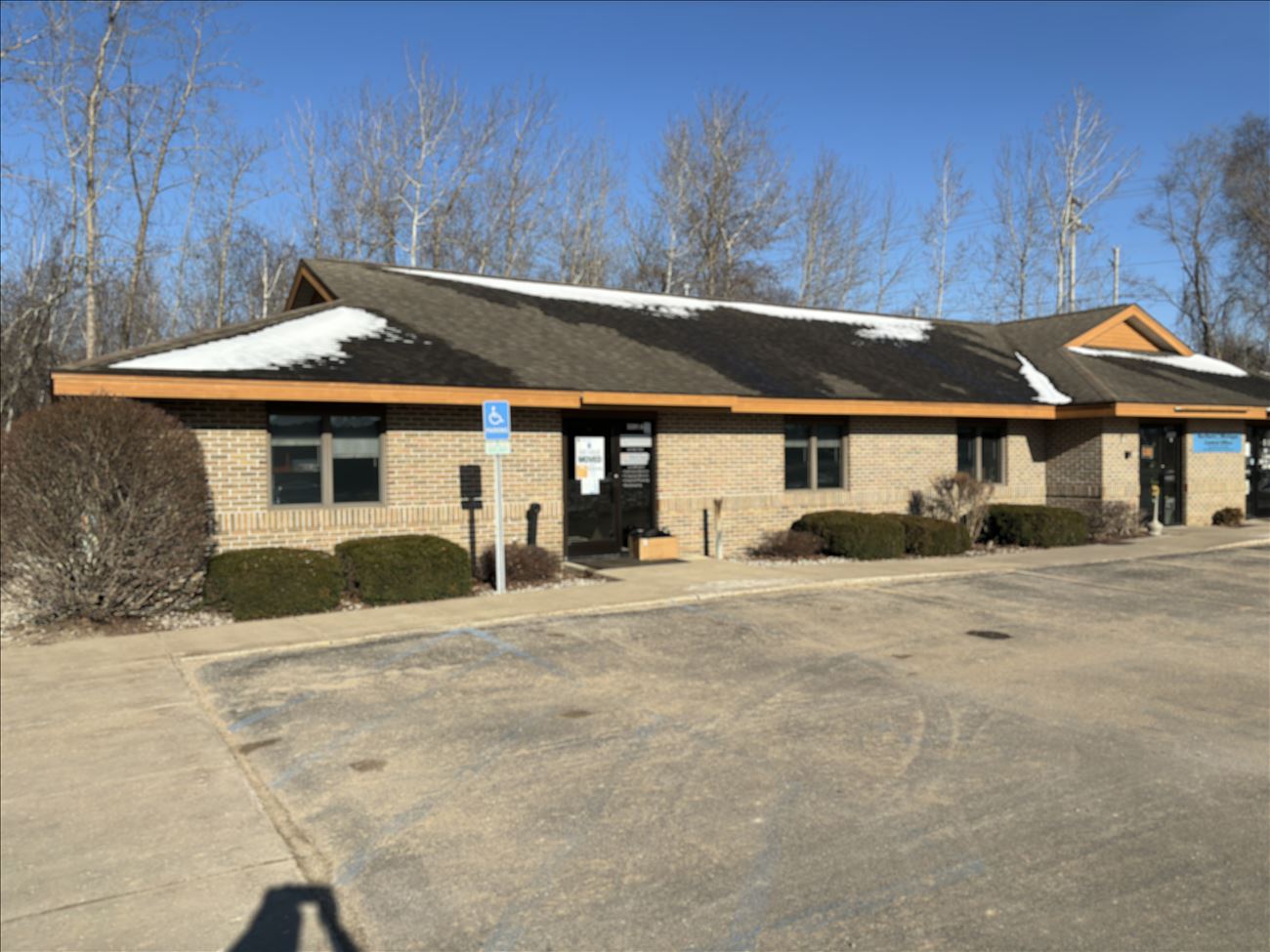 An out of focus picture of a brown office building. The building is the new location for Traverse Area Community Media.